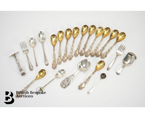 Twelve sterling silver gilt egg spoons, 12.2 cms in length, approx 233.6 gms. This lot concludes with two miniature forks, th