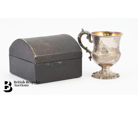 A velvet lined box containing a Victorian silver christening mug, with gilded interior, London dated 1838, mm Edward, John &a