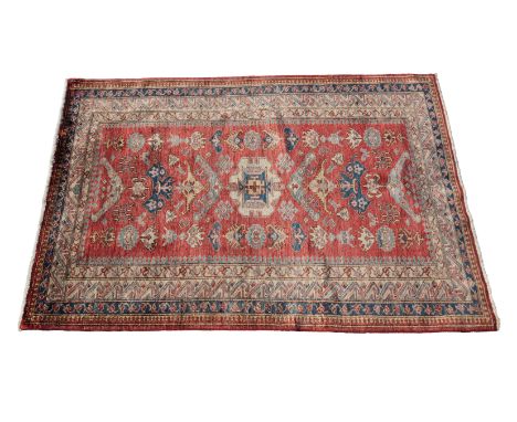 A mid-20th Century Persian Keshan/Kashan rug.  The rug is made with fine wool with natural dyes with a tight weave, red groun