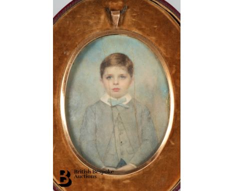 An 19th century portrait miniature watercolour of a young boy in blue by Charles James Turrell (1846-1932) monogrammed and da