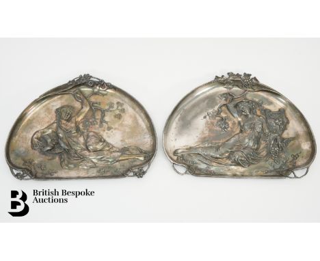 A pair of WMF (Wurttembergische Mettallwaren Fabrik) Art Nouveau wall plaques depicting classical scenes, each bearing impres
