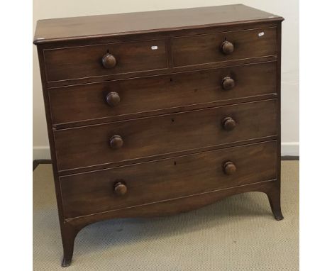 A Victorian mahogany square front chest of two short over three long graduated drawers with turned knob handles, on swept bra