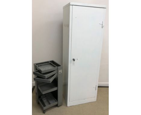 A painted metal single door cupboard with adjustable shelves, 61 cm wide x 46 cm deep x 181 cm high, together with a Graf-Ser