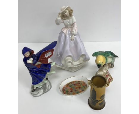 A Royal Doulton figurine "May" (HN 2746), circa 1987, a Royal Doulton figurine "Free as the wind" (HN 3139), circa 1987, a Be