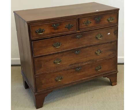 A 19th Century mahogany square front chest of two short over three long drawers with brass swan neck handles, raised on brack