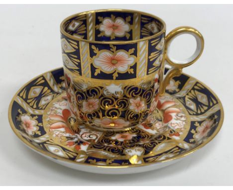 A set of six Royal Crown Derby Imari pattern coffee cups and saucers together with a matching sugar bowl and similar milk jug