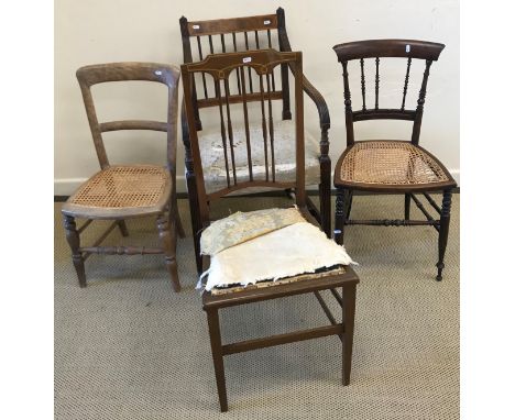A Victorian button back salon chair with blue upholstery, raised on turned and ringed front legs to brass caps and china cast