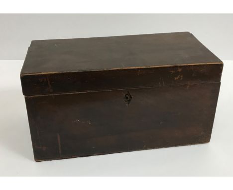 A 19th Century mahogany tea caddy of rectangular form, the lid opening to reveal two compartments and central well, 30 cm wid