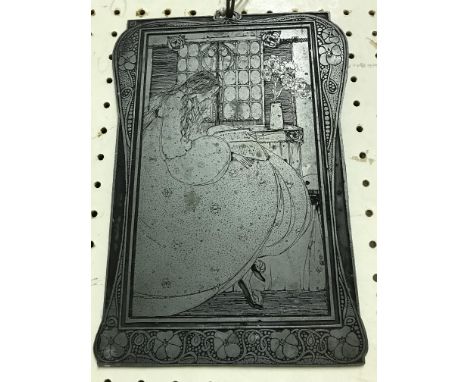 A late 19th Century engraved printing plate depicting a seated girl reading by window within an Art Nouveau style framework i