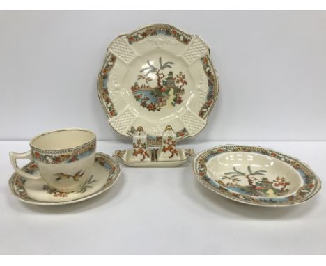 A large collection of Burslem "Coronet" dinner/tea wares including various sized plates, a graduated set of three jugs, tea p