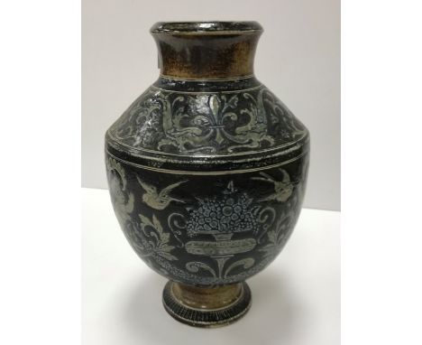 A late 19th Century Martin Brothers pottery vase with Classical cherubic and garland decoration, inscribed "6.5.84 RW Martin 