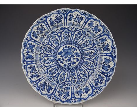 Chinese porcelain B/W charger with flowers-Marked-Kangxi 1662-1722. Diameter: 35 cm. In good condition. Just a few tiny frits