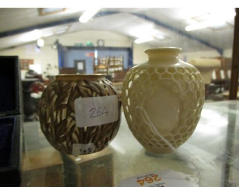 PAIR OF ROYAL WORCESTER EARLY 20TH CENTURY VASES, THE FIRST DOUBLE WALLED WITH AN OUTER RETICULATED FINISH, THE SECOND WITH A