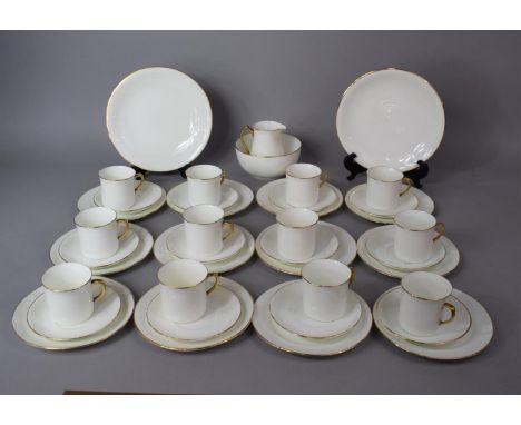A Gilt and White Coffee Set to comprise Twelve Cans, Milk and Sugar, Twelve Saucers, Twelve Side Plates, Two Large Plates Etc