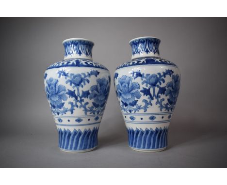 A Pair of Blue and White Baluster Vases with Floral Decoration, Having Six Character Mark for Kangxi to Base, 32cm High (One 