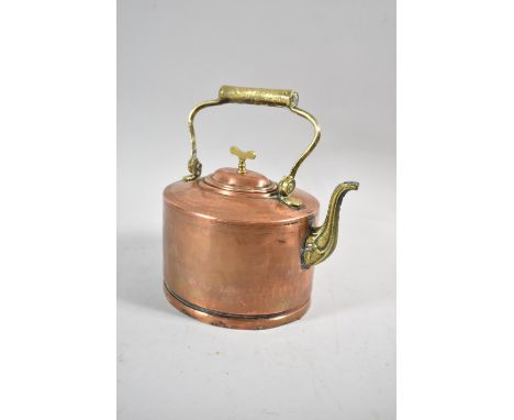 A Late 19th/Early 20th Century Copper Kettle of Oval Form with Folding Brass Handle, Finial and Spout, 25cm high