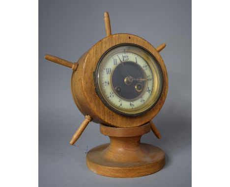 A Novelty Mantle Clock in the Form of a Ships Wheel on Turned Wooden Socle, 28cm high 