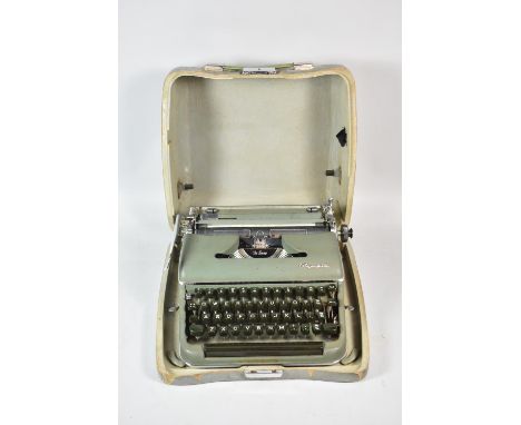 A Vintage Olympia Manual Portable Typewriter in Metal Case 