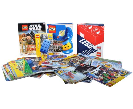 A large quantity of assorted Lego instruction manuals, magazines and reference books to include; Lego Collectors guide 1949 -