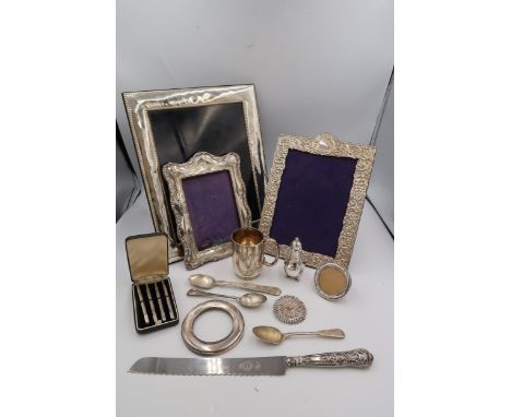 A collection of silver items to include photo frames, christening mug, bridge pencils etc and an Italian filled silver photo 