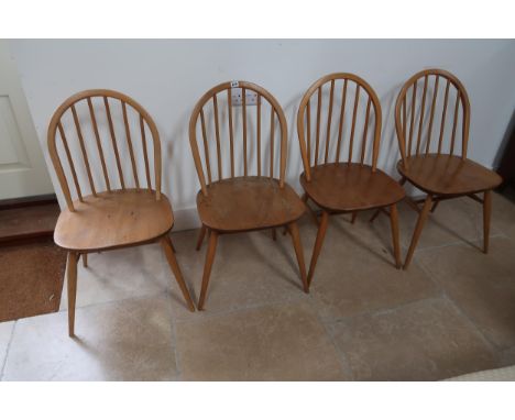 A set of four Ercol dining chairs