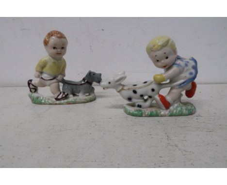 An original vintage Mabel Lucy Attwell figures of Sarah and Sam walking their dogs, made by Wade circa 1959, approx 8cm high