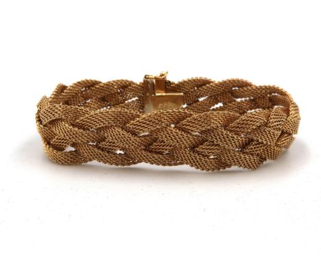A vintage 1970's 18ct gold woven and braided bracelet, 18cm long, 37.3g.