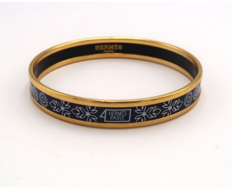 Hermès, Paris - Enamel bangle or bracelet, with floral design and six panels of plants, internally stamped 'Hermes Paris' and