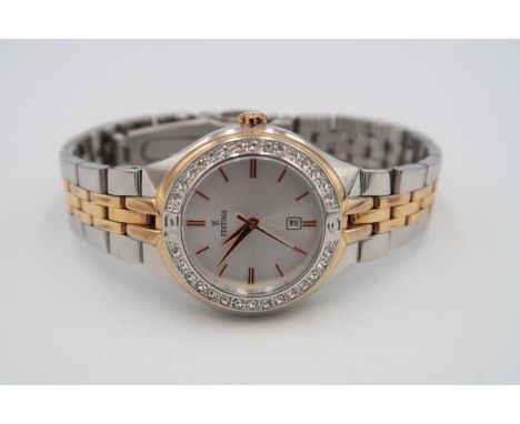 A lady's Festina watch, the signed dial with date aperture to 6 o'clock, with rose gold coloured baton numerals and hands and