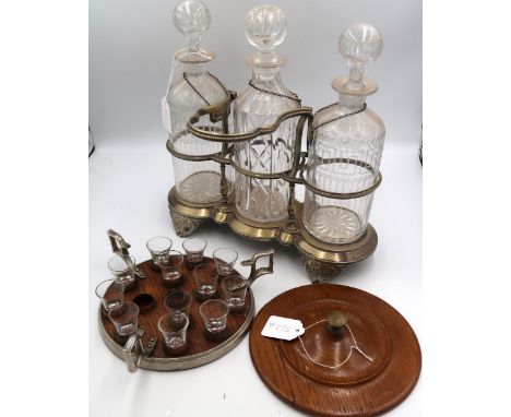 A 19th century oak shot class tray with lid. Originally a communion tray. Together with a silver plated three decanter stand 