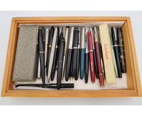 A group of vintage pens, predominantly fountain pens including Swan, Conway Stewart and Parker, and a propelling pencil.