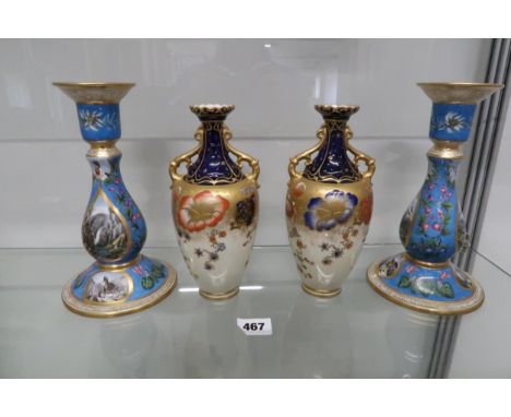 A matching pair of painted candleholders, continental scenes, painted 1877 on inside, 20cm tall, good condition, together wit