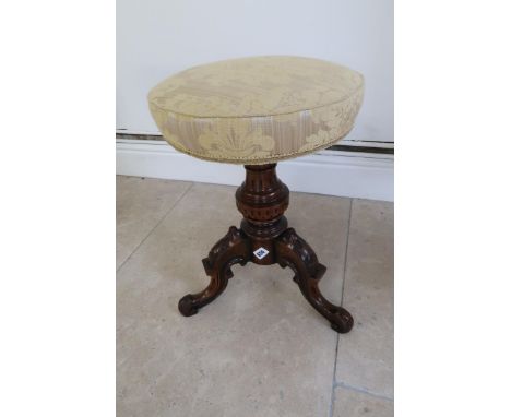 A 19th century walnut piano stool