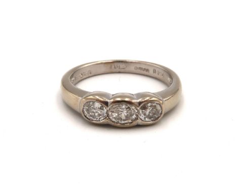 An 18ct white gold three stone oval diamond ring, diamonds are a very good colour and clarity, approx G VS1, 0.74ct of diamon