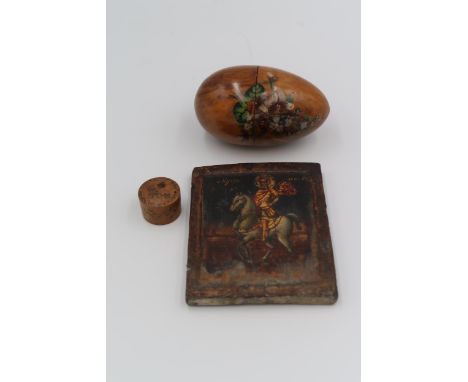 A Greek icon of St Minas on horseback, on oak panel, 11 by 9cm, together with an olive wood vintage souvenir egg for Fontainb