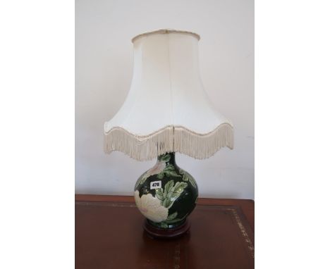 A Moorcroft table lamp and shade - in good condition