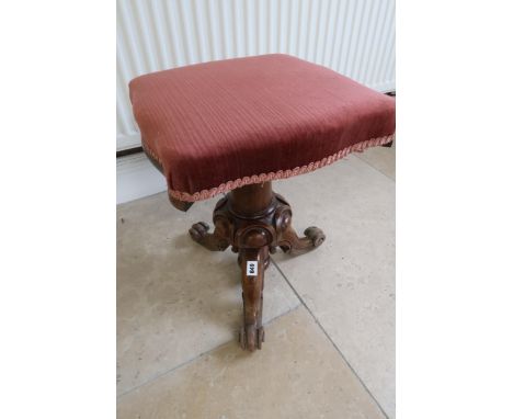 A 19th century walnut piano stool