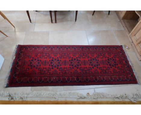 A hand knotted woollen runner, 200cm x 75cm