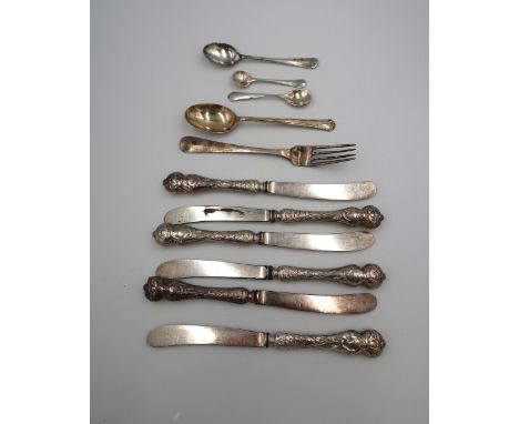 A group of silver comprising a christening spoon, monogram engraved, a similarly sized fork, a teaspoon, a salt spoon, and a 