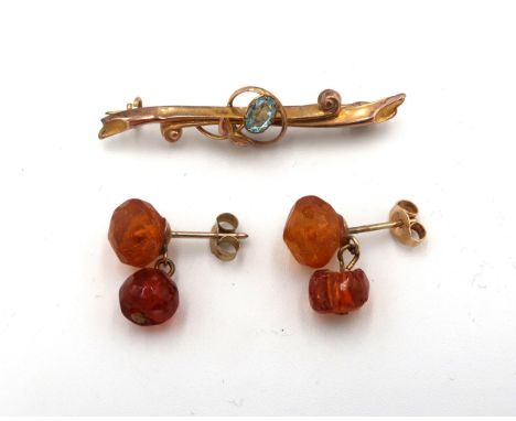 A Victorian 9ct gold bar brooch set with an aquamarine coloured stone, 1.2g, 4cm long, and a pair of vintage amber drop earri