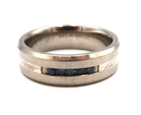 A gentleman's titanium and sapphire five stone ring, in modern channel setting, size U, 4.8g.