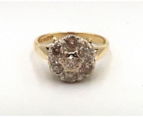 A vintage 18ct yellow gold seven stone diamond cluster ring, diamonds well matched, bright and lively, head size approx 12mm 