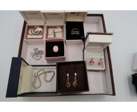 A collection of silver and costume jewellery to include Pandora and Swarovski