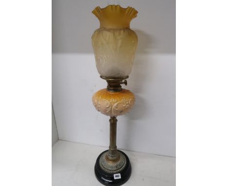 An oil lamp and shade