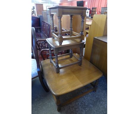 An Ercol Golden Dawn elm coffee table and a pair of lamp tables 