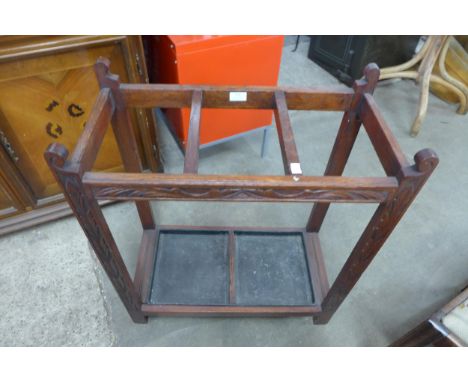 A carved oak stick stand 