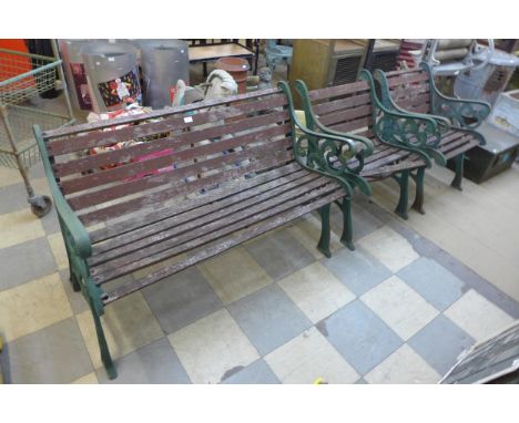 A cast iron ended garden bench and a pair of armchairs 