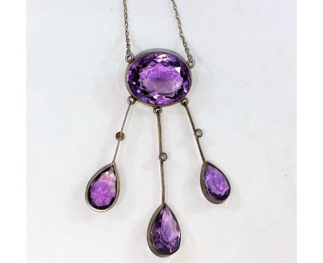 An Arts and Crafts white metal negligee pendant set oval amethyst with three drops each set single seed pearl and pear shaped