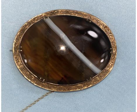 A Victorian large brooch set agate in 9 carat hallmarked gold chased surround 