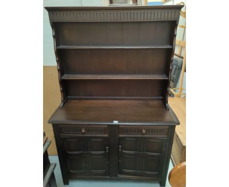An Ercol style dark oak Welsh dresser 